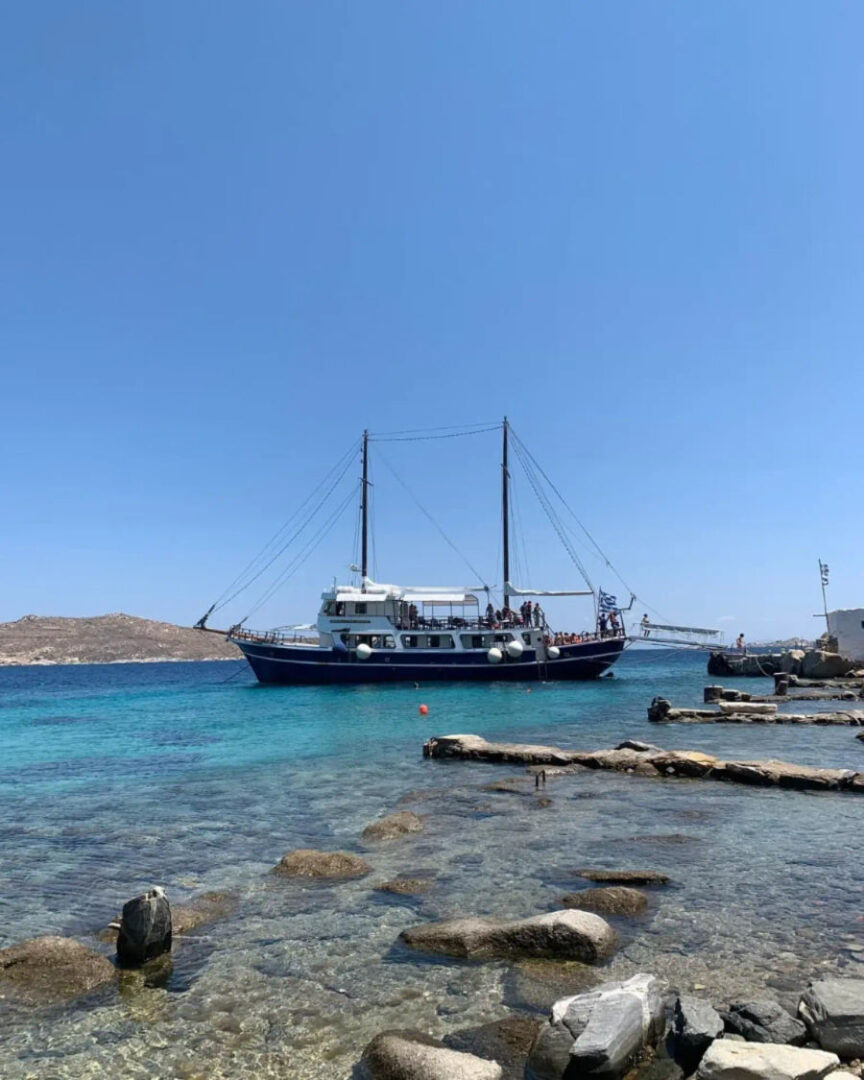 Luxurious Caique cruise ship with wooden deck for Mykonos, Rhenia, and Delos boat trip by On Board Events