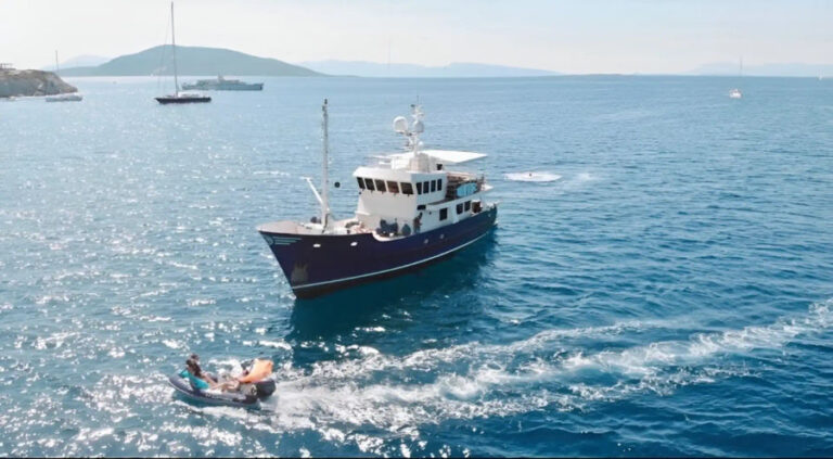 A motor yacht cruising the waters of Athens during the Athenian Angler Adventure by Events on Board.