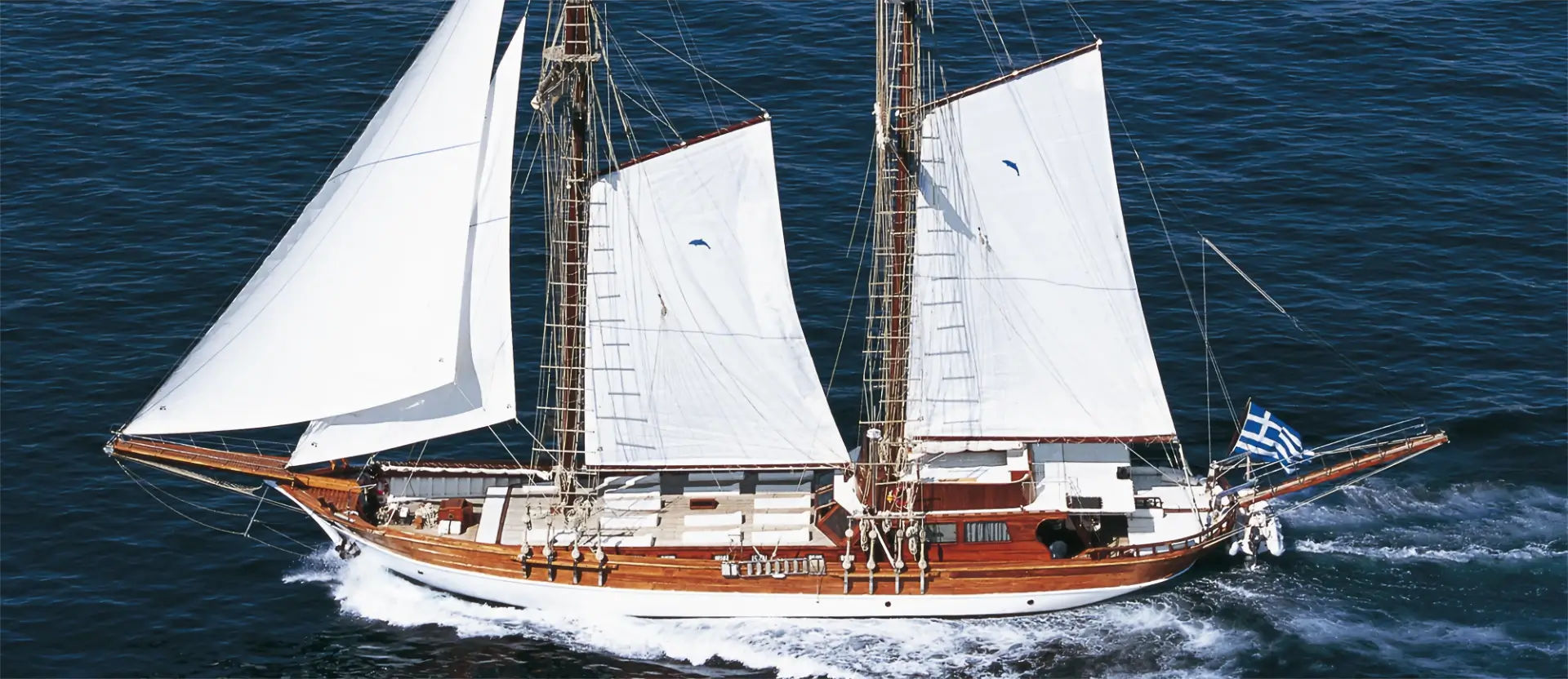 The luxurious Motor Sailer Erato, a 98ft Gulet, on the sparkling waters of Athens, featured in the Athens Premium Luxury Gulet Cruise by Events on Board.