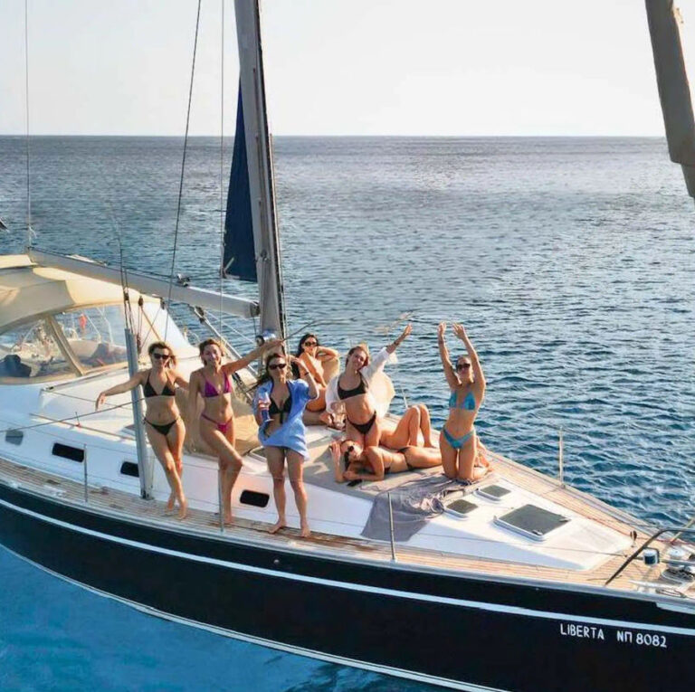 Guests enjoying the sun and sea breeze on the deck of the Ocean Star 51.2 during the Mykonos sailing yacht adventure event by Events on Board.
