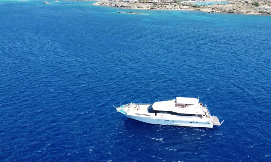 Mykonos Day Cruise with Tecnomarine 92 | Delos, Rhenia & South Coast Beaches Golden Yachting and Sailing