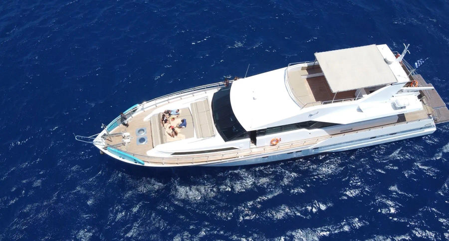 Mykonos Day Cruise with Tecnomarine 92 | Delos, Rhenia & South Coast Beaches Golden Yachting and Sailing