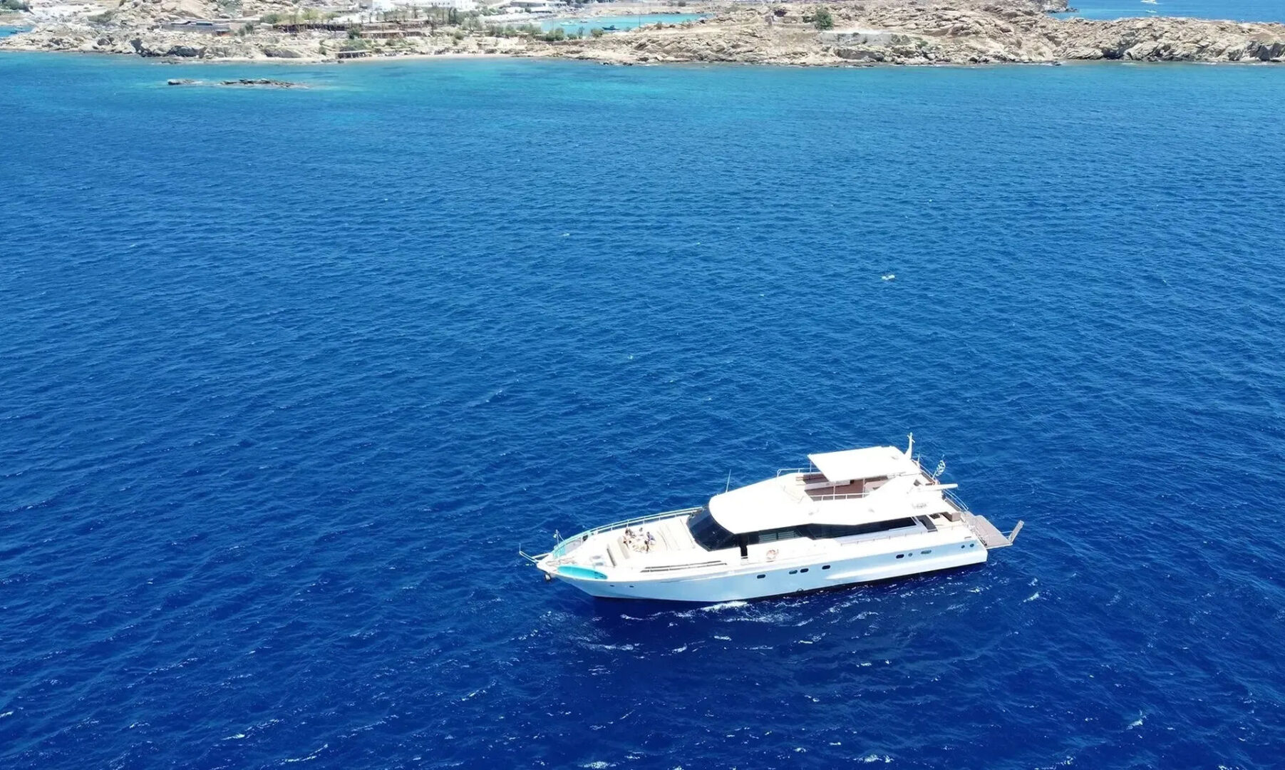 Mykonos Day Cruise with Tecnomarine 92 | Delos, Rhenia & South Coast Beaches Golden Yachting and Sailing