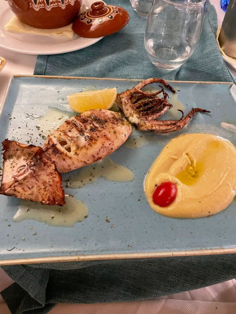 A grilled seafood plate with lemon on the Alfayacht 56 during the Gastronomy Sailing Cruise in Athens Riviera by Events on Board.