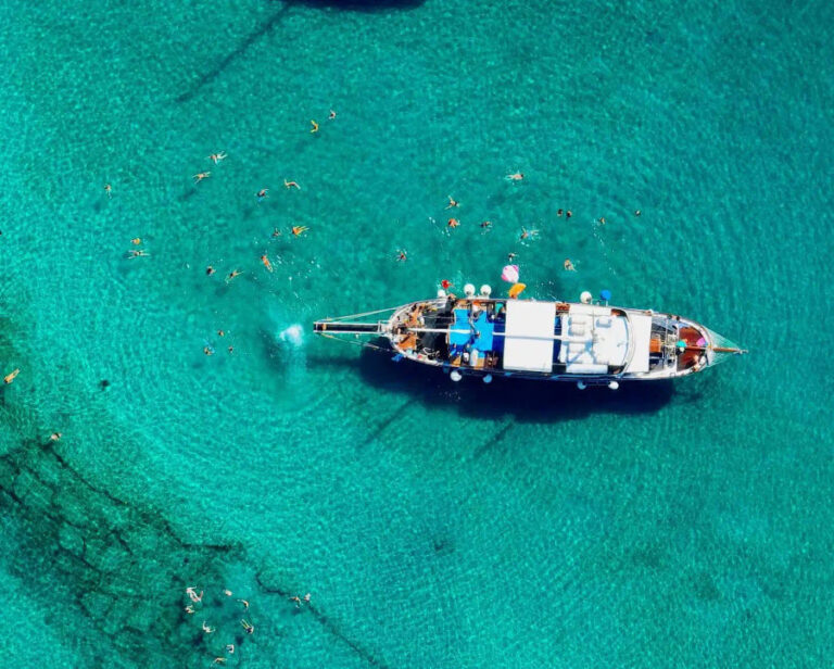 Luxurious Caique cruise ship with wooden deck for Mykonos, Rhenia, and Delos boat trip by On Board Events